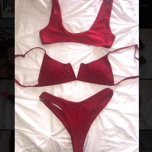 Two bikini tops and one bottom